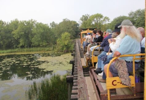 People travel by open air rail through the Tiffany Bottoms