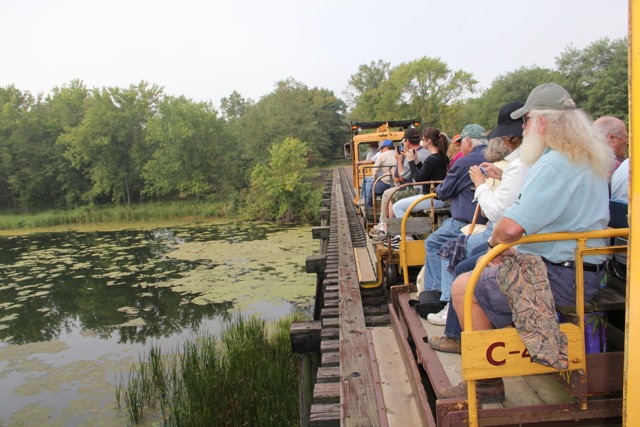 People travel by open air rail through the Tiffany Bottoms
