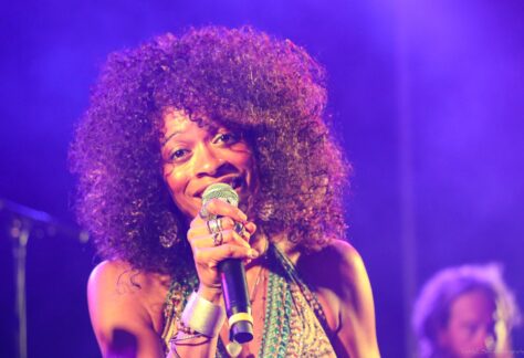 A woman singing blues on stage