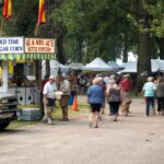 People enjoy an art fair