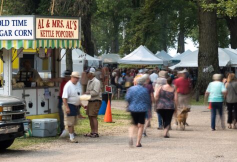 People enjoy an art fair