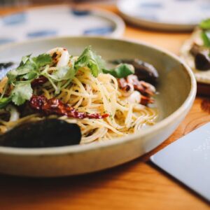 Linguini and shrimp in a bowl
