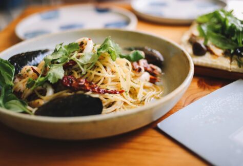 Linguini and shrimp in a bowl
