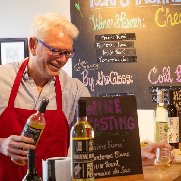 A man pours wine at a wine tasting