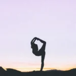 silhouette figure doing a yoga pose