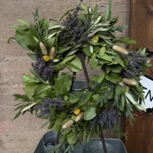 dried lavender wreath hanging on an easel