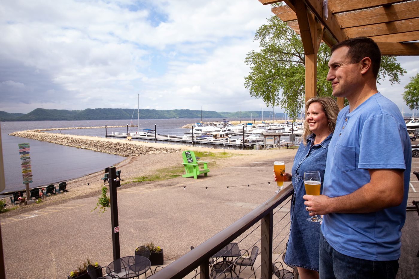 A couple look over the water at a restaurant in downtown Pepin