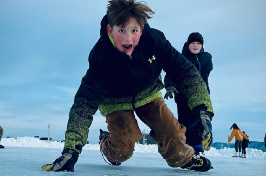 icecrash Pepin_2 a boy laughs as he skids on the ice.